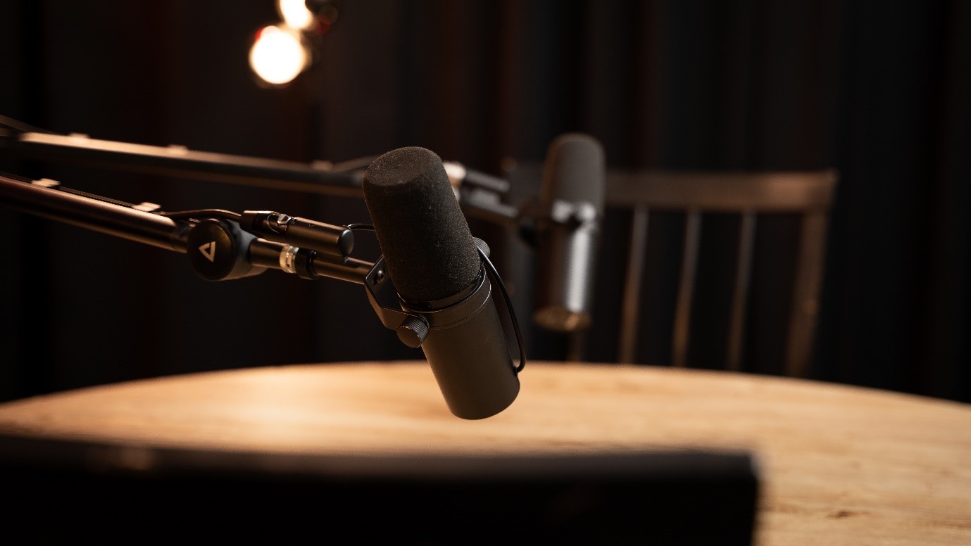 An image of two microphones position for two chairs either side of a small wooden table
